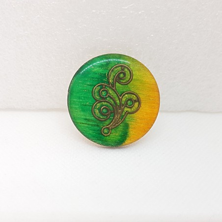 Broche vintage aux couleurs jaune vert et bronze forme ronde au bel aspect émail