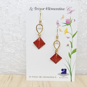Paire de boucles d'oreilles pendante fantaisie orange et or décor ovale doré,