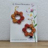 Paire de boucle d'oreille fantaisie décor fleur évidée orangé sur créole doré, réversible monture acier inoxydable